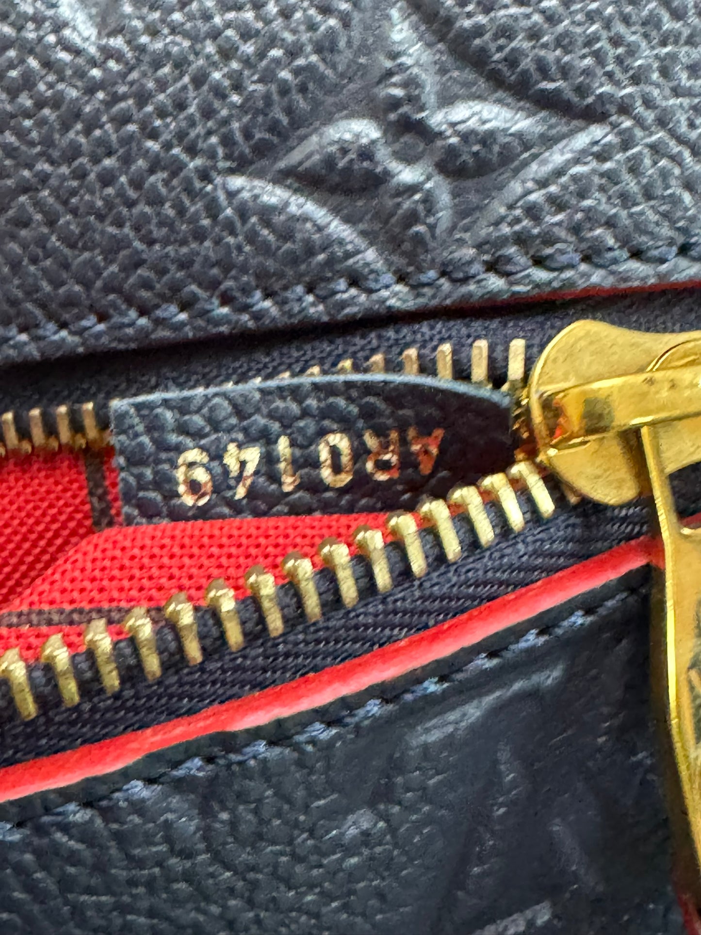 Louis Vuitton Pochette Métis in Marine Rouge Empreinte Leather