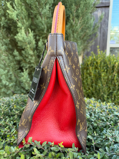 Louis Vuitton Gaia in Monogram Canvas with Red Accent