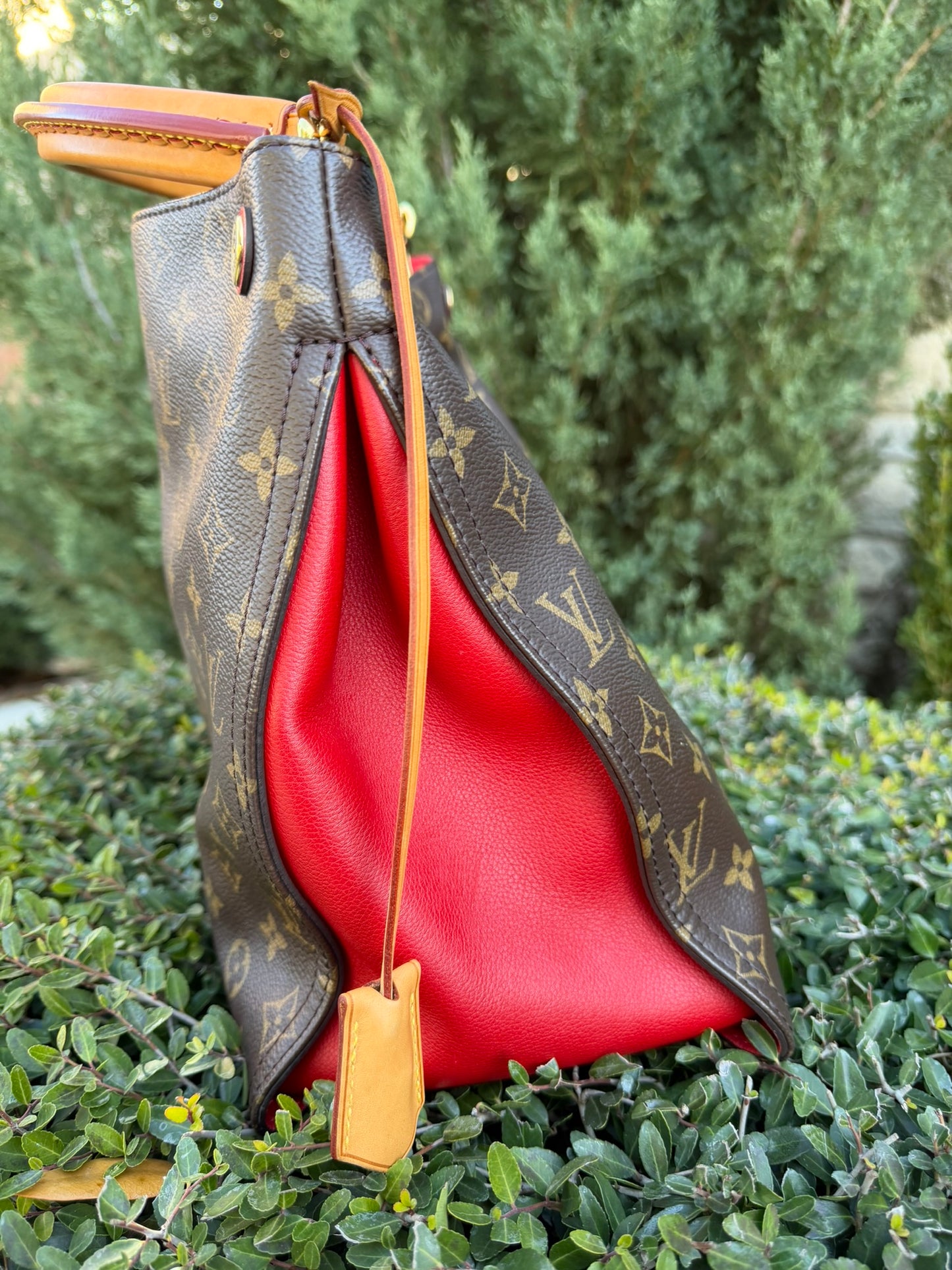 Louis Vuitton Gaia in Monogram Canvas with Red Accent