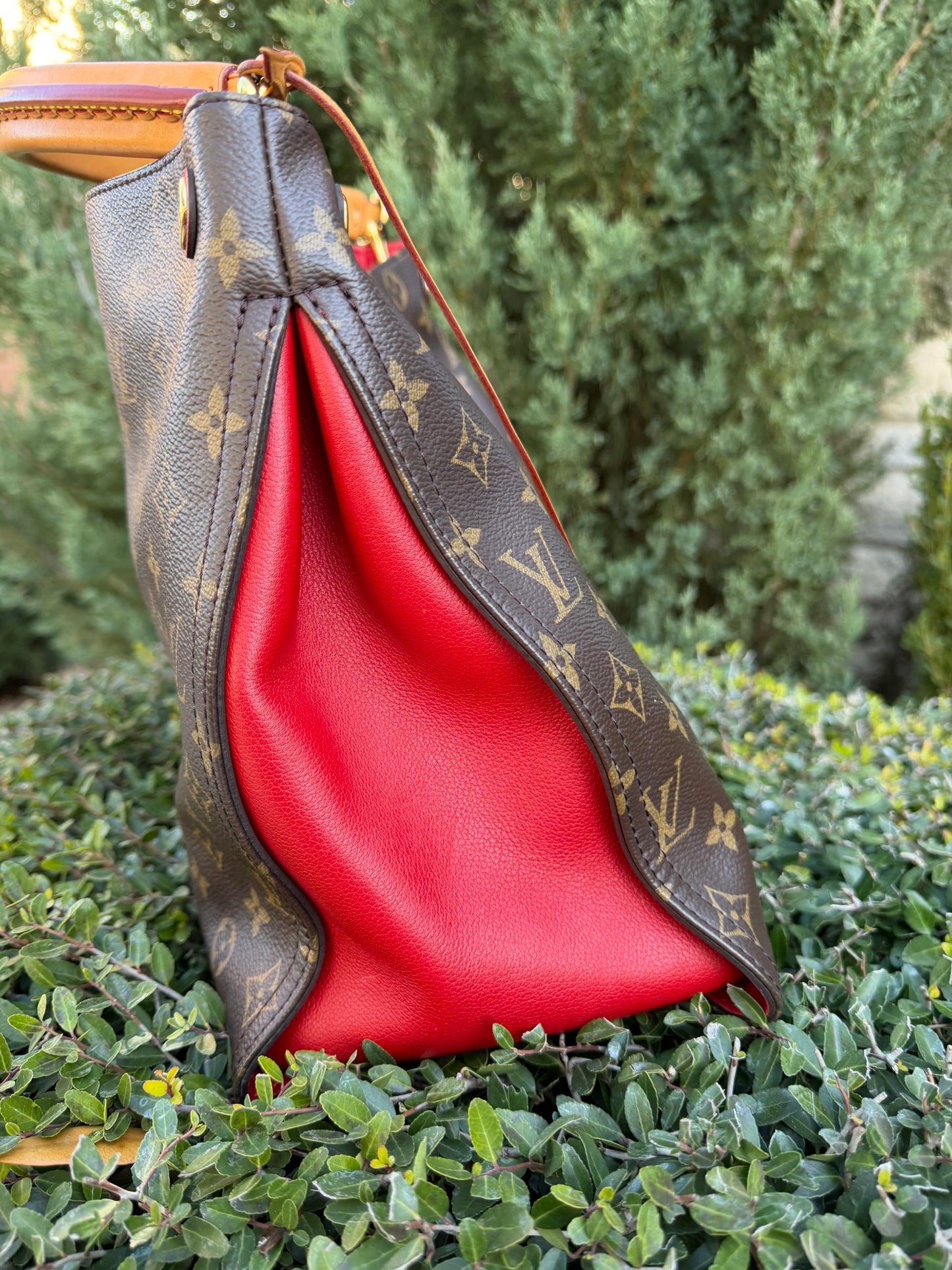 Louis Vuitton Gaia in Monogram Canvas with Red Accent