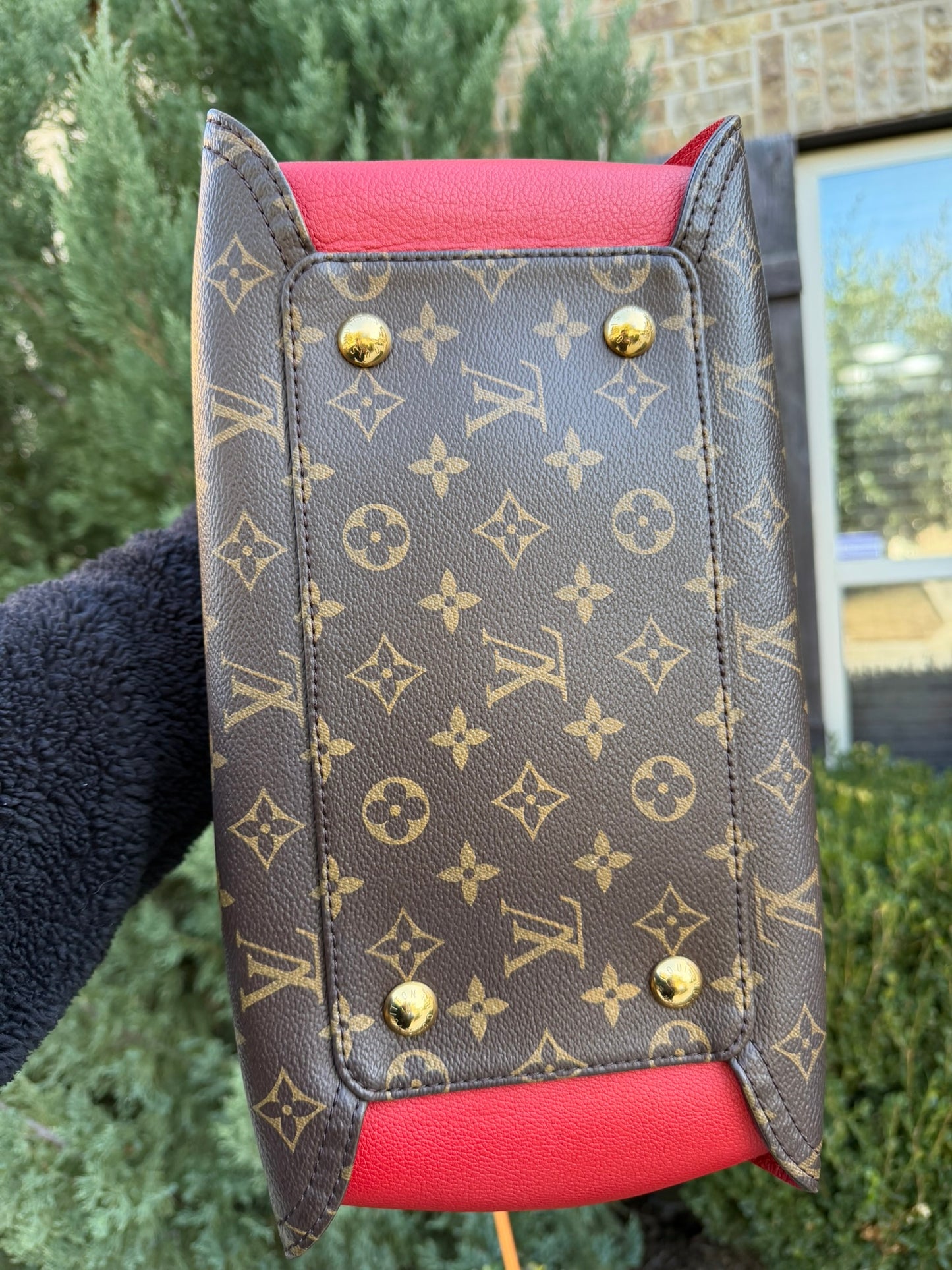 Louis Vuitton Gaia in Monogram Canvas with Red Accent