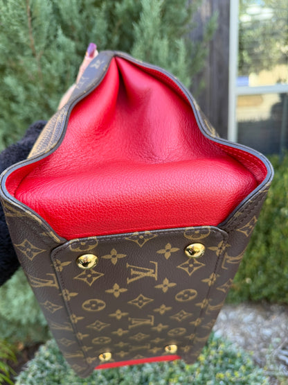 Louis Vuitton Gaia in Monogram Canvas with Red Accent