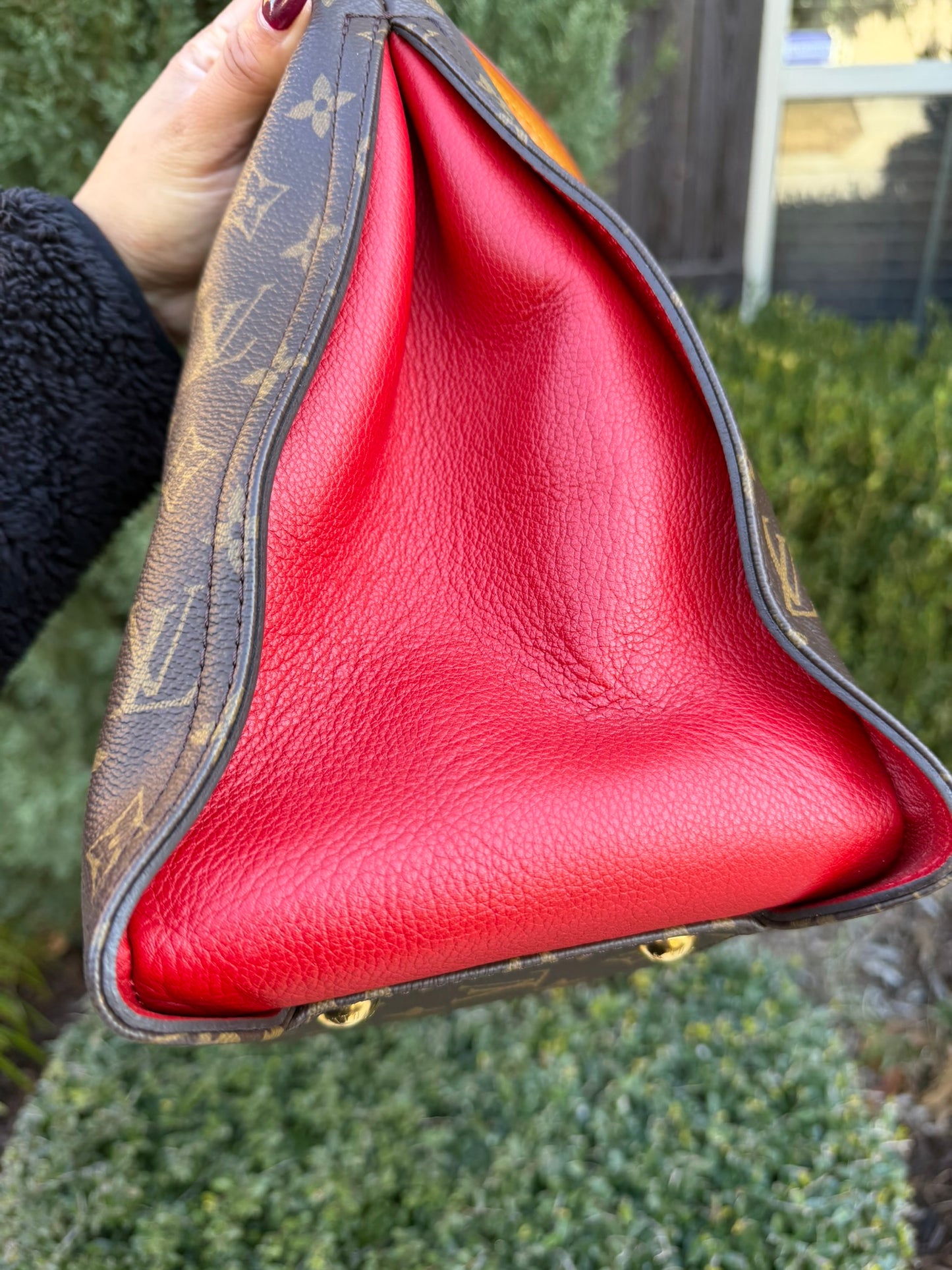 Louis Vuitton Gaia in Monogram Canvas with Red Accent