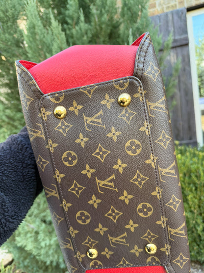 Louis Vuitton Gaia in Monogram Canvas with Red Accent