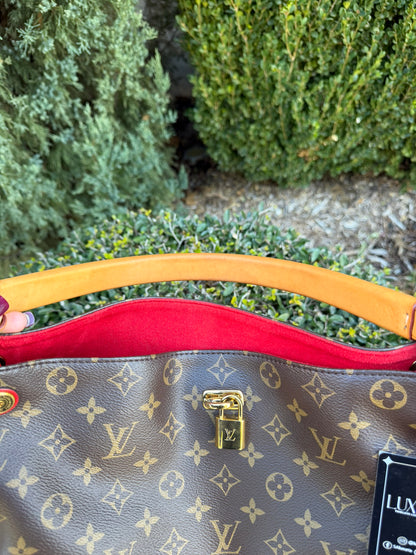 Louis Vuitton Gaia in Monogram Canvas with Red Accent