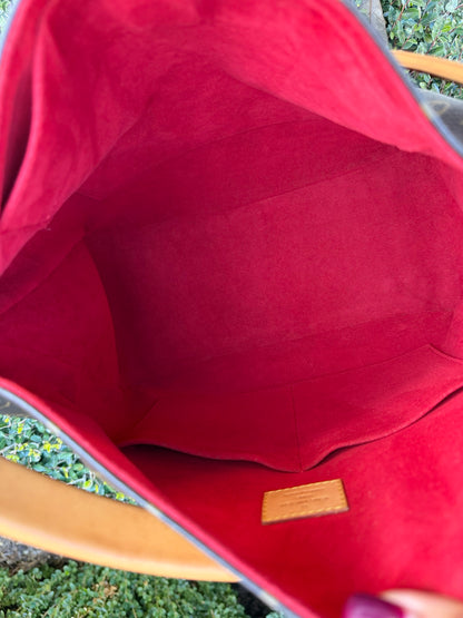 Louis Vuitton Gaia in Monogram Canvas with Red Accent