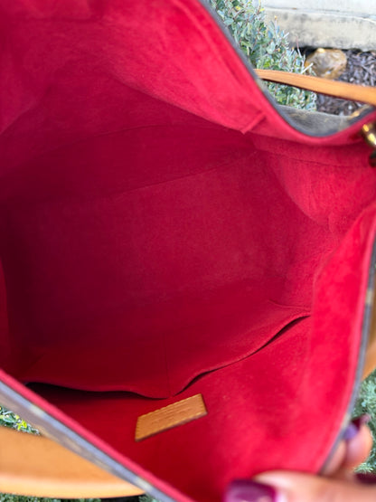 Louis Vuitton Gaia in Monogram Canvas with Red Accent