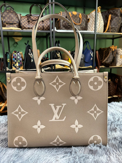 Louis Vuitton OnTheGo MM in Bicolor Monogram Empreinte Leather (Tourterelle/Cream)