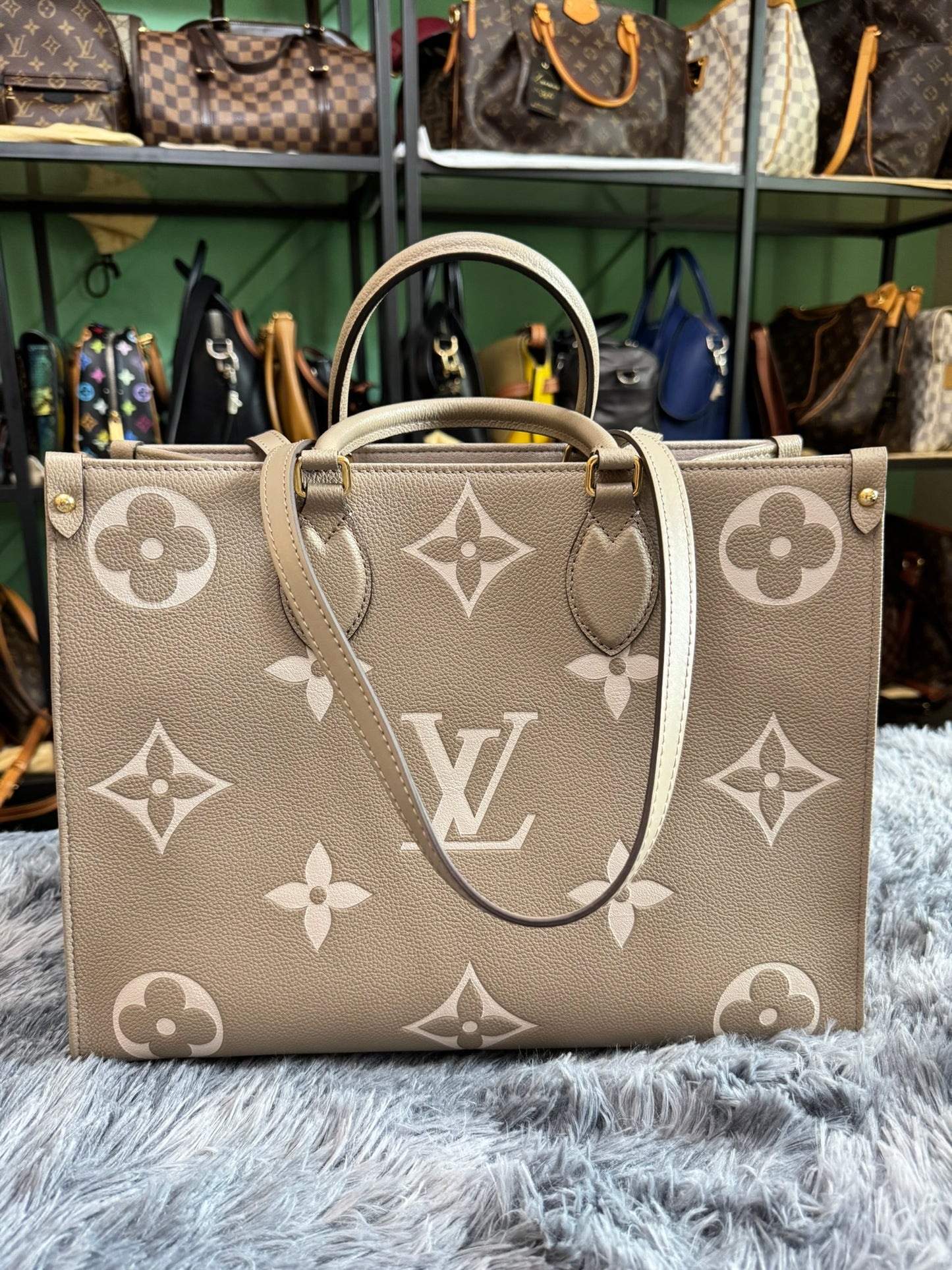 Louis Vuitton OnTheGo MM in Bicolor Monogram Empreinte Leather (Tourterelle/Cream)