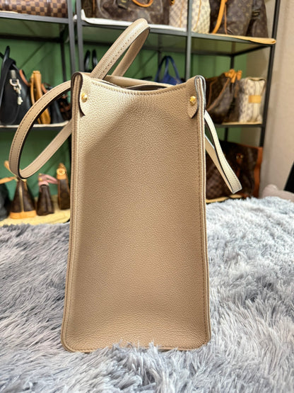 Louis Vuitton OnTheGo MM in Bicolor Monogram Empreinte Leather (Tourterelle/Cream)