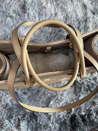 Louis Vuitton OnTheGo MM in Bicolor Monogram Empreinte Leather (Tourterelle/Cream)