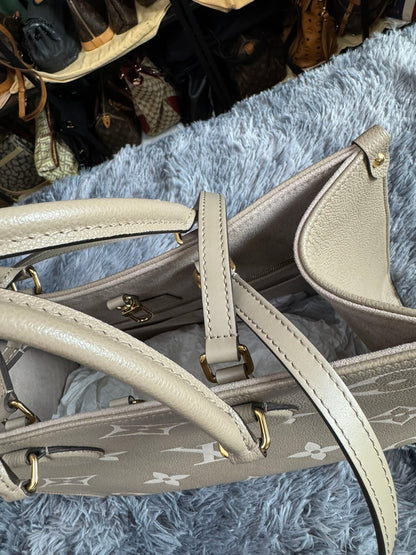 Louis Vuitton OnTheGo MM in Bicolor Monogram Empreinte Leather (Tourterelle/Cream)