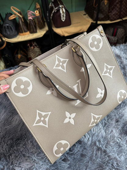 Louis Vuitton OnTheGo MM in Bicolor Monogram Empreinte Leather (Tourterelle/Cream)