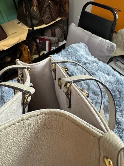 Louis Vuitton OnTheGo MM in Bicolor Monogram Empreinte Leather (Tourterelle/Cream)