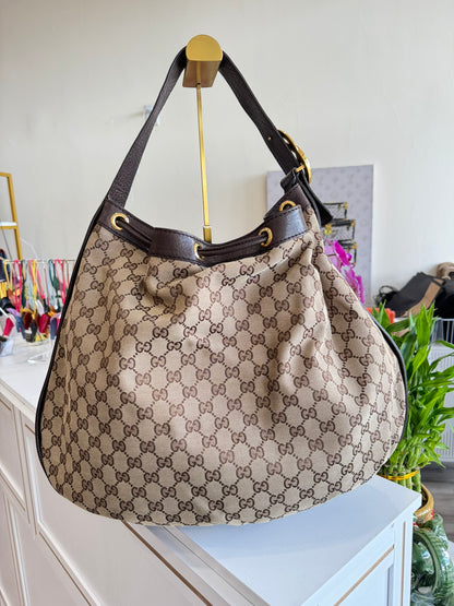 Gucci GG Drawstring Hobo Bag in Monogram Canvas