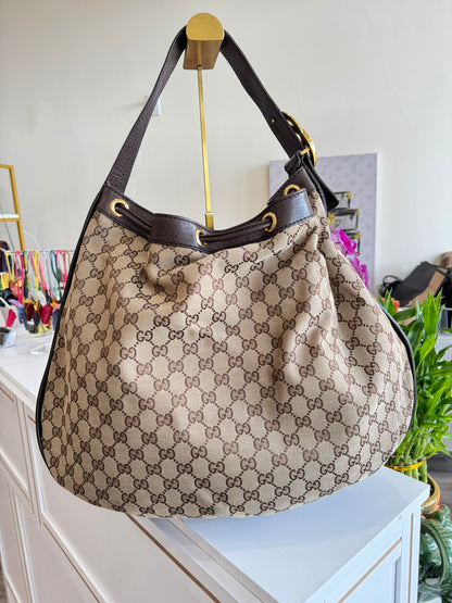 Gucci GG Drawstring Hobo Bag in Monogram Canvas
